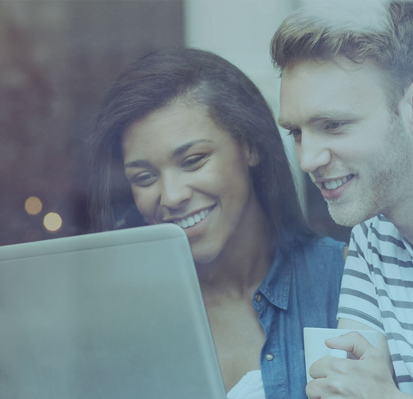 People smiling at laptop