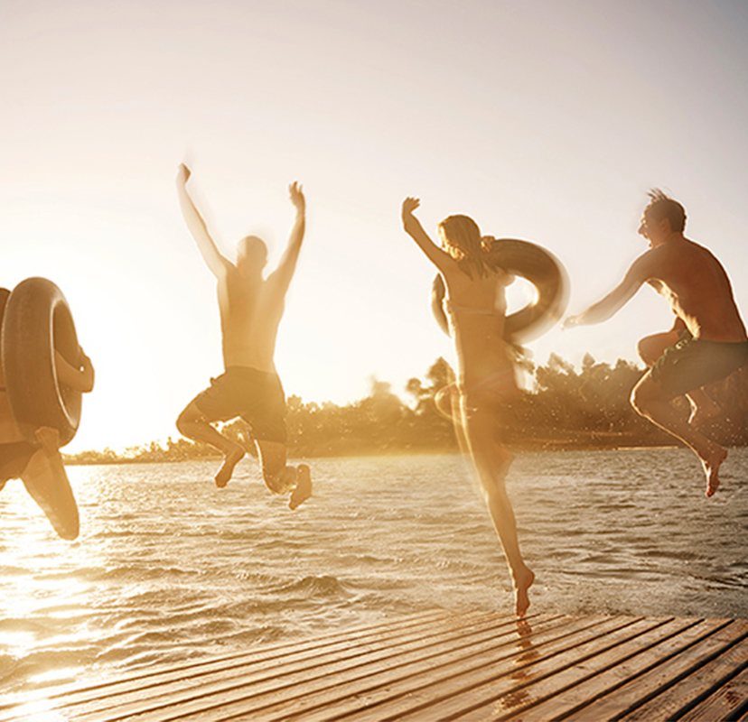 People jumping into water